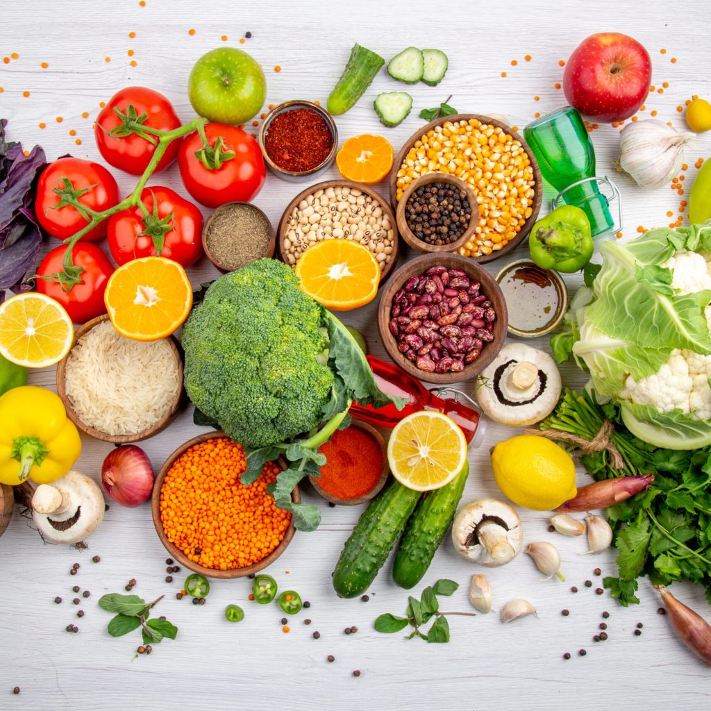 top-view-fresh-foods-spices-vegetables-cooking-white-table